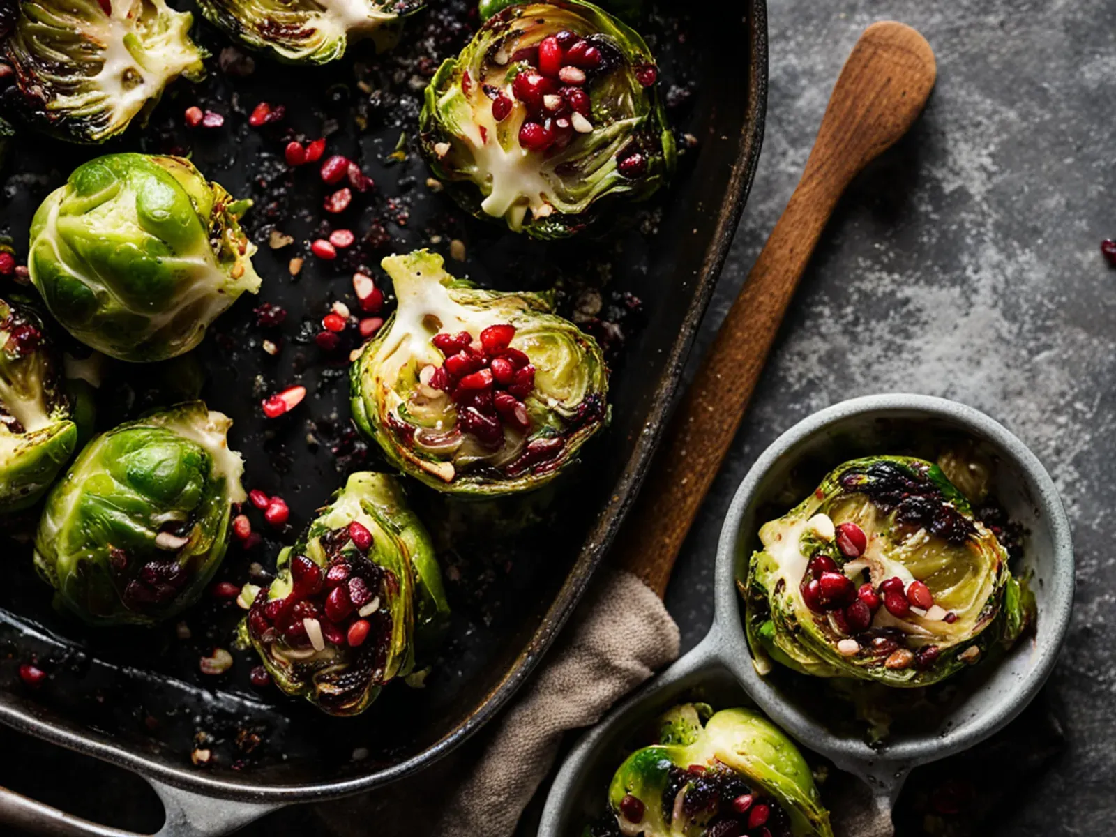 Crispy Lemon Parmesan Smashed Brussels Sprouts with Pomegranate — Smashed Brussels sprouts with parmesan, roasted until the edges crackle, then topped with garlic, lemon zest, chil